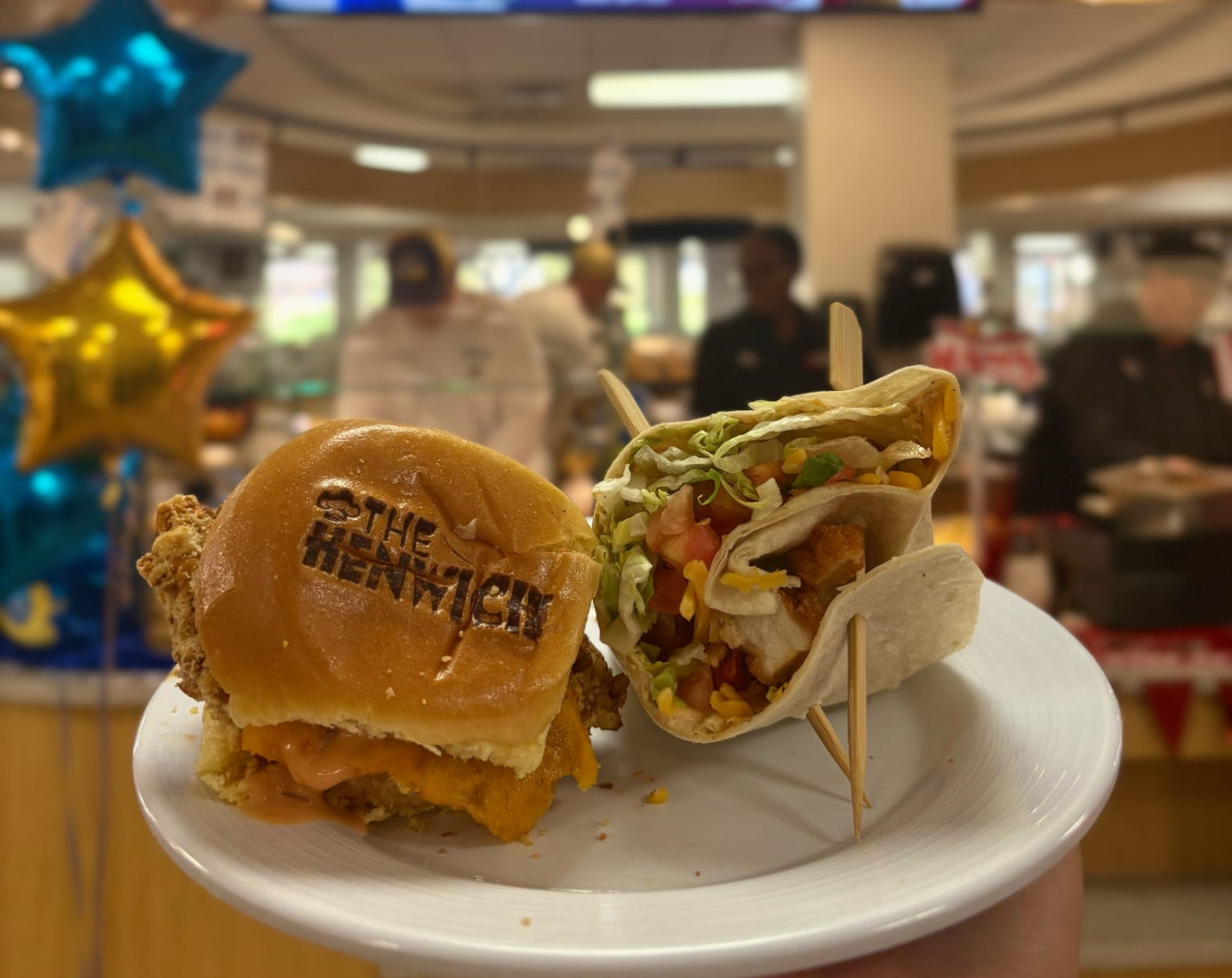 A chicken sandwich and a chicken wrap. 